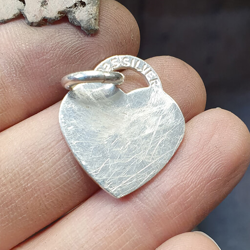 Sterling Silver heart with many scratches